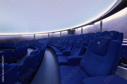 Seats at the planetarium with blank screen