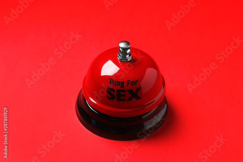 Sex bell on red background. Erotic role play