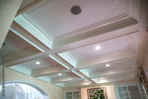Coffered ceiling and a lot of natural light from the large windows.
