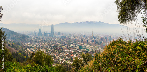 Panoramic view of Santiago's pollution with the Andes Mountains as background from San Cristobal Hill in Chile.