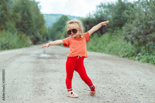 little girl dancing in glasses