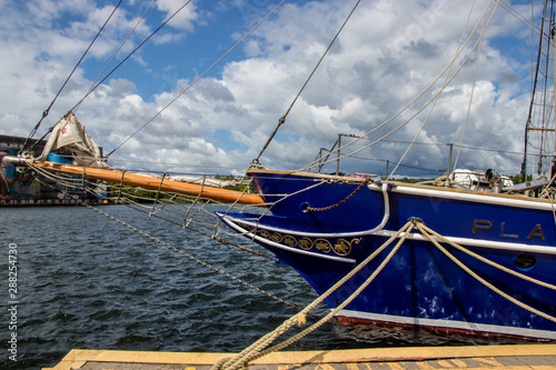 tall ship bowsprit and the Midland, Ontario, town dock