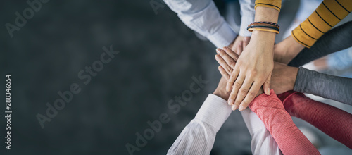 Stack of hands. Unity and teamwork concept.