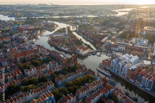 Gdansk is a city in Poland. Gdansk in the morning rays, the sun is reflected from the roofs of the old city.
