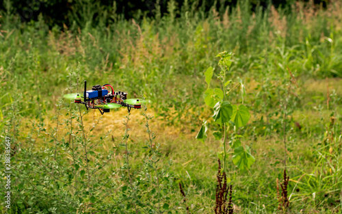 DIY drone flies on agricultural field