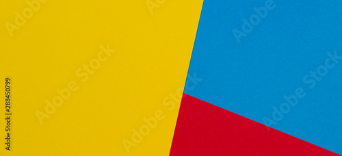 Abstract yellow, red and light blue color paper geometry composition background