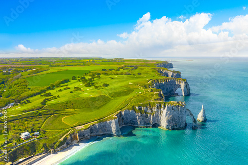 Picturesque panoramic landscape on the cliffs of Etretat. Natural amazing cliffs. Etretat, Normandy, France, La Manche or English Channel. Coast of the Pays de Caux area in sunny summer day. France