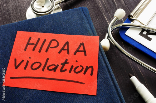 Hipaa violation inscription on a piece of paper.