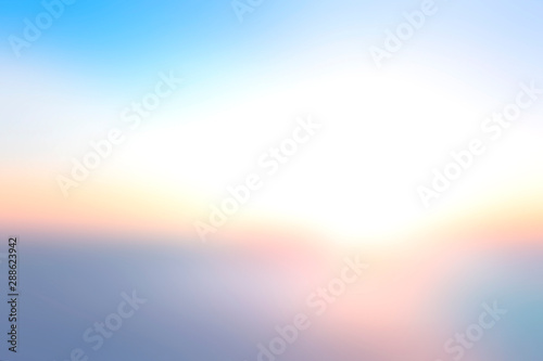 Hope concept: Bokeh light and abstract blurry blue sky and clouds mountain sunrise background