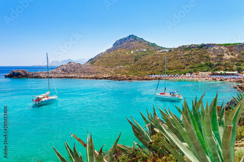 Sea skyview landscape photo Ladiko bay near Anthony Quinn bay on Rhodes island, Dodecanese, Greece. Panorama with nice sand beach and clear blue water. Famous tourist destination in South Europe