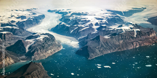 Western coast of Greenland, aerial view of glacier, mountains and ocean