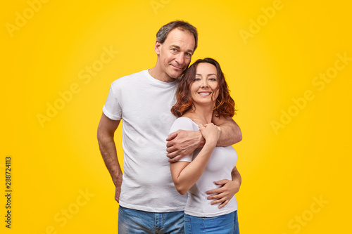 Happy mature couple looking at camera