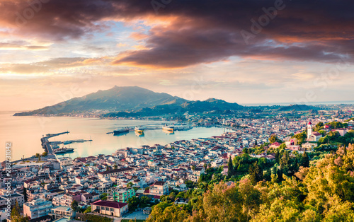 Aerial view of Zakynthos (Zante) town. Dramatic spring sunrise on Ionian Sea. Beautiful cityscape panorama of Greece city. Traveling concept background. Artistic style post processed photo.