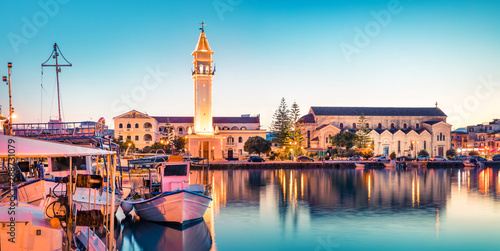 Amazing spring sunset in Zakynthos city. Beautiful evening panorama of town hall and Saint Dionysios Church, Ionian Sea, Zakynthos island, Greece, Europe. Traveling concept background.
