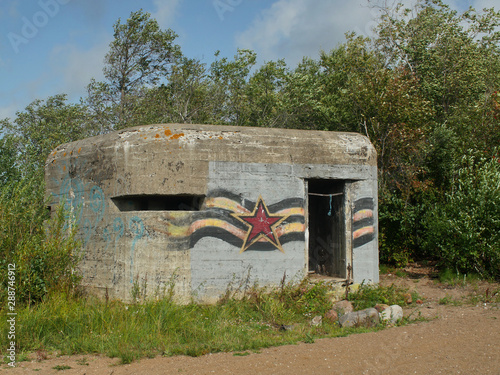 St. Petersburg, Russia, August 27, 2019 Old soviet military pillbox with graffiti