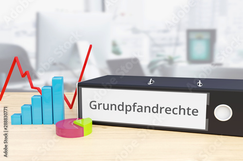 Grundpfandrechte – Finanzen/Wirtschaft. Ordner auf Schreibtisch mit Beschriftung neben Diagrammen. Business, Statistik