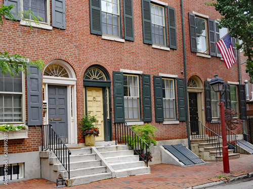 Row of brick American colonial style townhouses