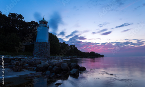 Lighthouse Taksensand on the Danish island als at sunset