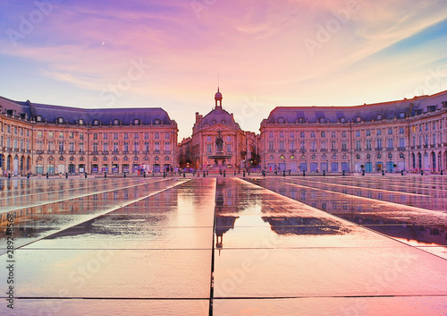 Colorful sunset at Place de la Bourse square in Bordeaux, France, one of the most visited and photographed sites in the Gironde Capital.