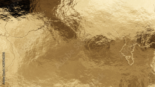 Shiny wrinkled golden foil texture. Crumpled metal background.