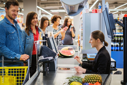 People buying goods in a grocery store