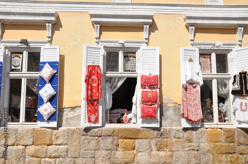 Windows of an old building in Szentendre Hungary with exposed folk handicrafts