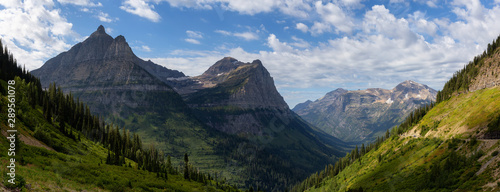 Beautiful Panoramic View of American Rockies from a viewpoint during a sunny summer day. Taken in Glacier National Park, Montana, United States of America.