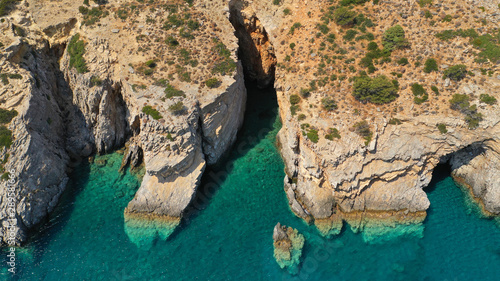 Aerial drone photo of paradise small beach of Mouros with caves and crystal clear sea, Amorgos island, Cyclades, Greece