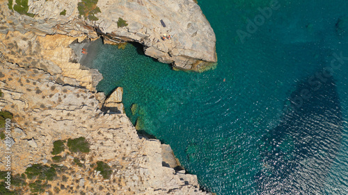 Aerial drone photo of paradise small beach of Mouros with caves and crystal clear sea, Amorgos island, Cyclades, Greece