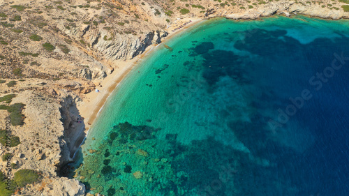 Aerial drone photo of secluded paradise beach of Gramvousa in small island of Gramvousa near Kalotaritissa with emerald clear sea, Amorgos island, Cyclades, Greece