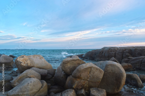  At the beach During the setting sun The wind blows cool. Beautiful clouds and rocks with sandy ground