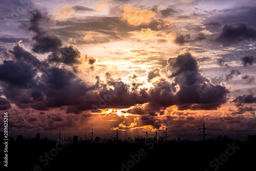 Romantic sunset sky with fluffy clouds and beautiful heavy weather landscape for use as background images