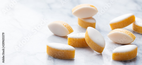 Calisson on marble table background. Traditional French Provence sweets. Copy space.