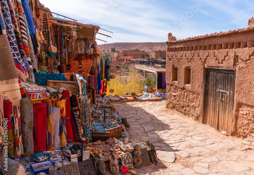 Streets in The fortified town of Ait ben Haddou near Ouarzazate on the edge of the sahara desert in Morocco. Atlas mountains. Street local ethnic market with goods and carpets