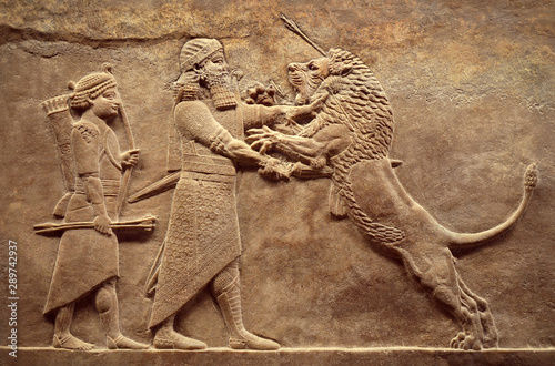 Assyrian relief of royal lion hunt, Babylonian and Sumerian art. Remains of ancient civilization of Mesopotamia. Middle East history concept.
