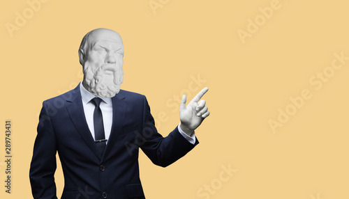 Modern art collage. Concepе зortrait of a Modern art collage. Concept portrait of a businessman pointing finger .Gypsum head of of Socrates. Man in suit.