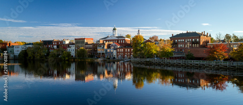 The river front buildings of Exeter, New Hampshire are seen reflected in the water