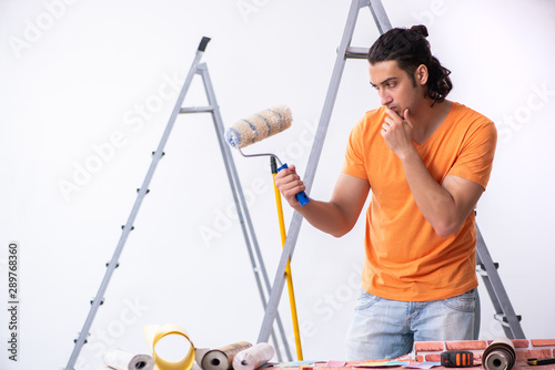 Young man contractor doing renovation at home