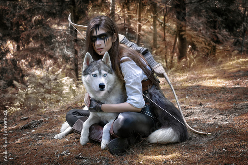 Fairytale art photo of a hunter with a wolf and a bow 