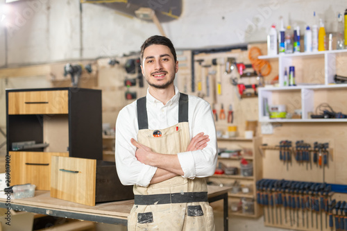 furniture factory, Small-Sized Companies and people concept - Portrait of a smiling male worker at manufacturing