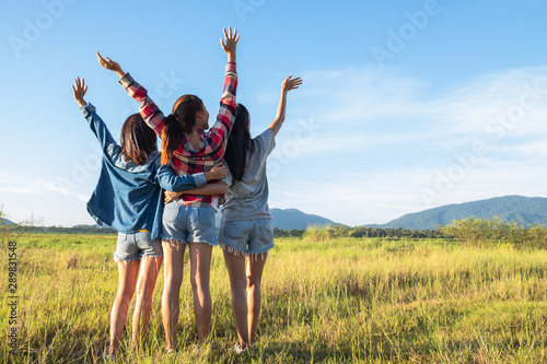 Group of young Asian women having fun and happy on summer holiday vacation in evening.