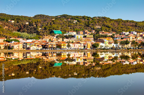 beautiful view of the city of carloforte which is reflected in the salt pan in the Island of San Pietro, Sardinia