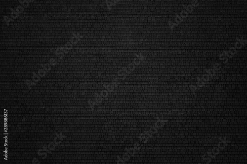 Abstract texture made of black paving tiles. Aerial view.