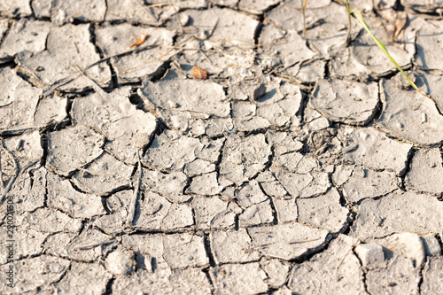 Cracked surface of dried clay soil background