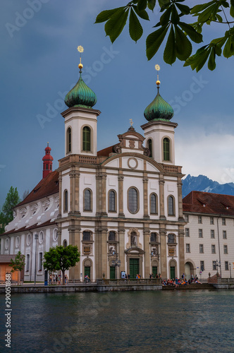 Jesuit Church and buildings on waterfront of Reuss River, Lucerne, Switzerland 