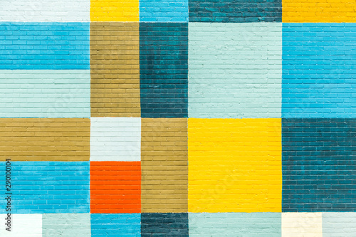  brick wall painted in rainbow colors