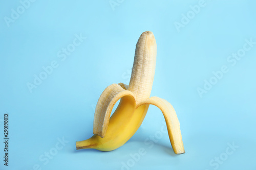 Fresh banana on light blue background. Sex concept