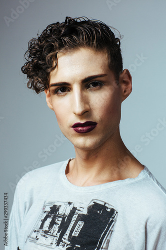 Portrait of a young man with make up