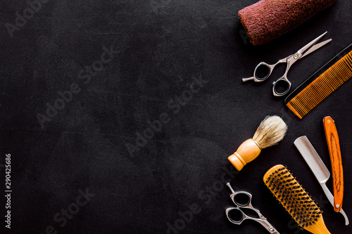Barbershop concept. Hairdressing tools on black background top view space for text
