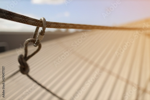 Rope access screwgate locking carabiner connecting with dynamic low stretch abseiling construction site roof top 